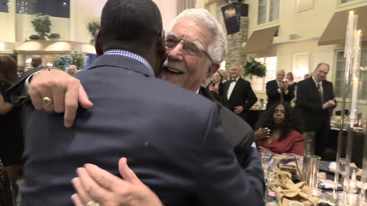 Crispus Attucks York CEO Robert "Bobby" Simpson Hugs Long Time Friend Bob Pullo