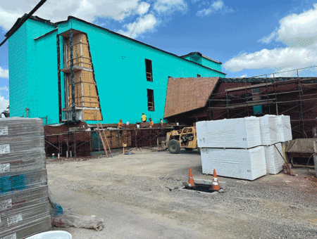 Why is the CAY History and Culture Center Building Painted Turquoise?